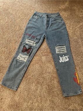 Distressed Women's Jeans with Graphic Details